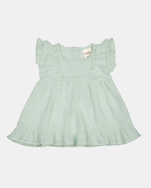 Soft sage baby dress by Toshi, featuring a cute design and comfortable fabric for little ones.