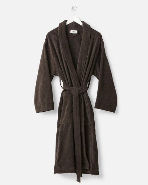 Brown robe hanging on a white background